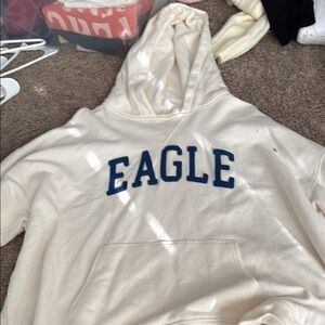American Eagle Outfitters Cream Hoodie with Blue Logo